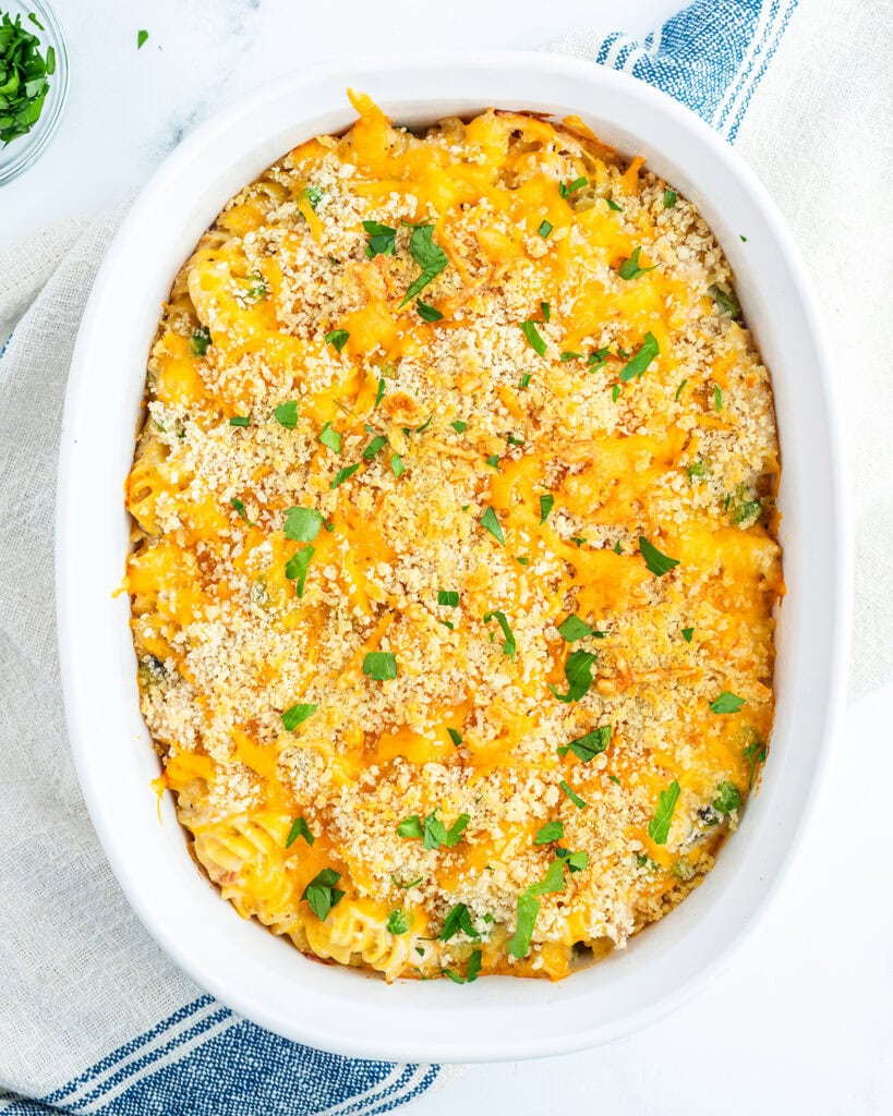 An above view of a baking dish full of Tuna casserole, topped with cheese and bread crumbs.