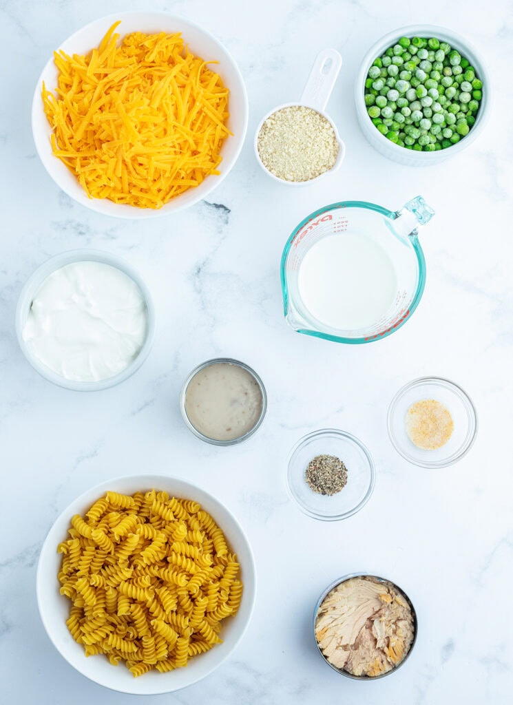 Bowls of the ingredients needed to make tuna noodle casserole. 