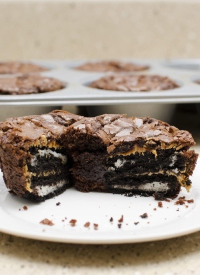 Front view of peanut butter oreo brownie cups on a white plate.