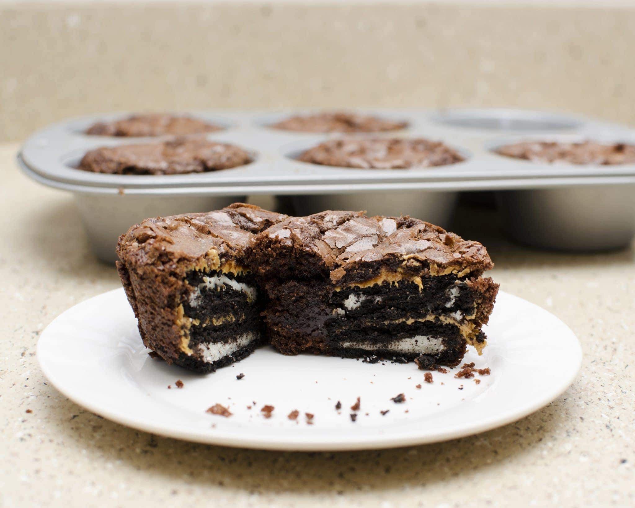 Front view of peanut butter oreo brownie cups on a white plate.