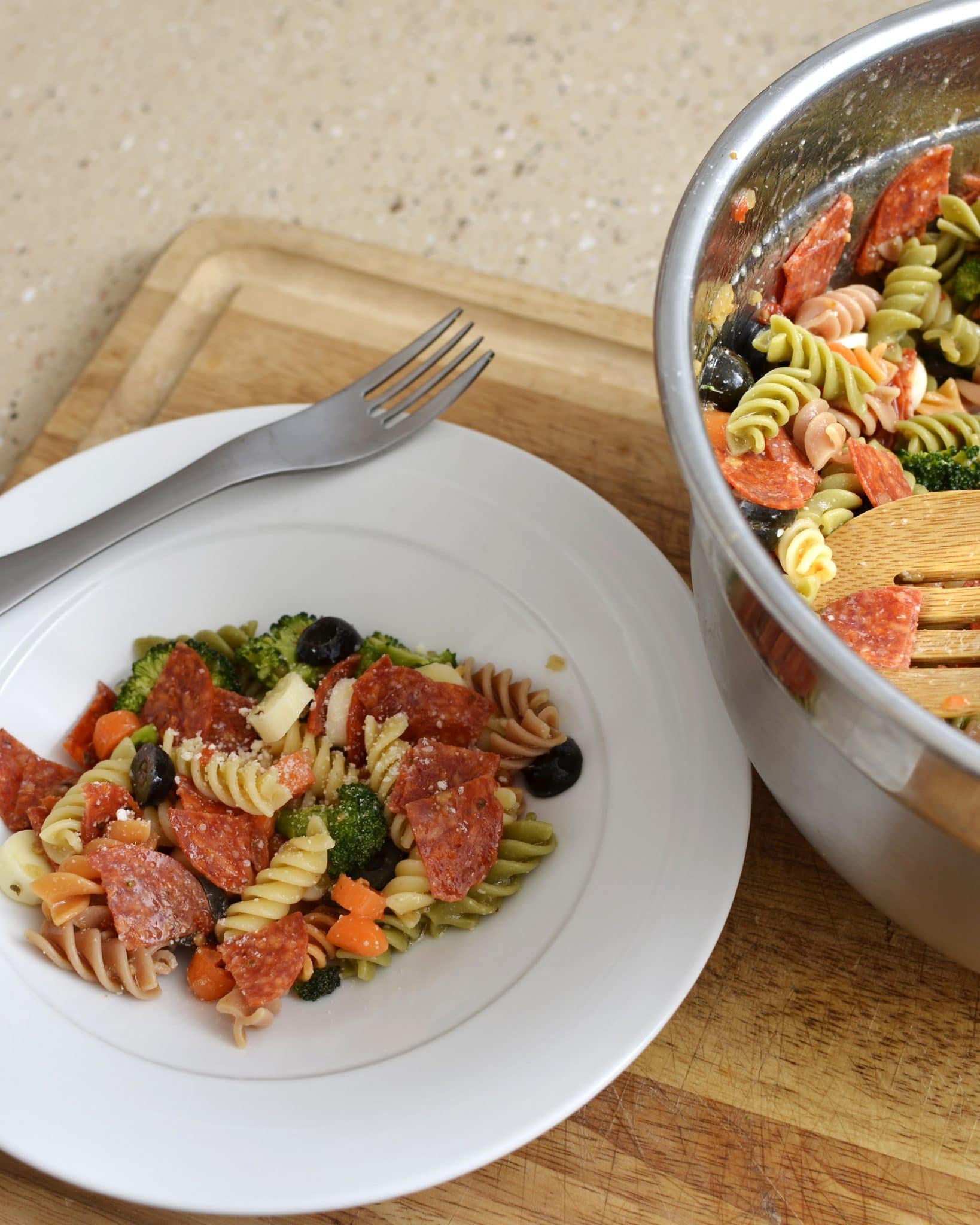 Angled view of pasta salad on a white plate.