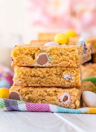 A stack of 3 blondies full of Cadbury Mini Eggs.