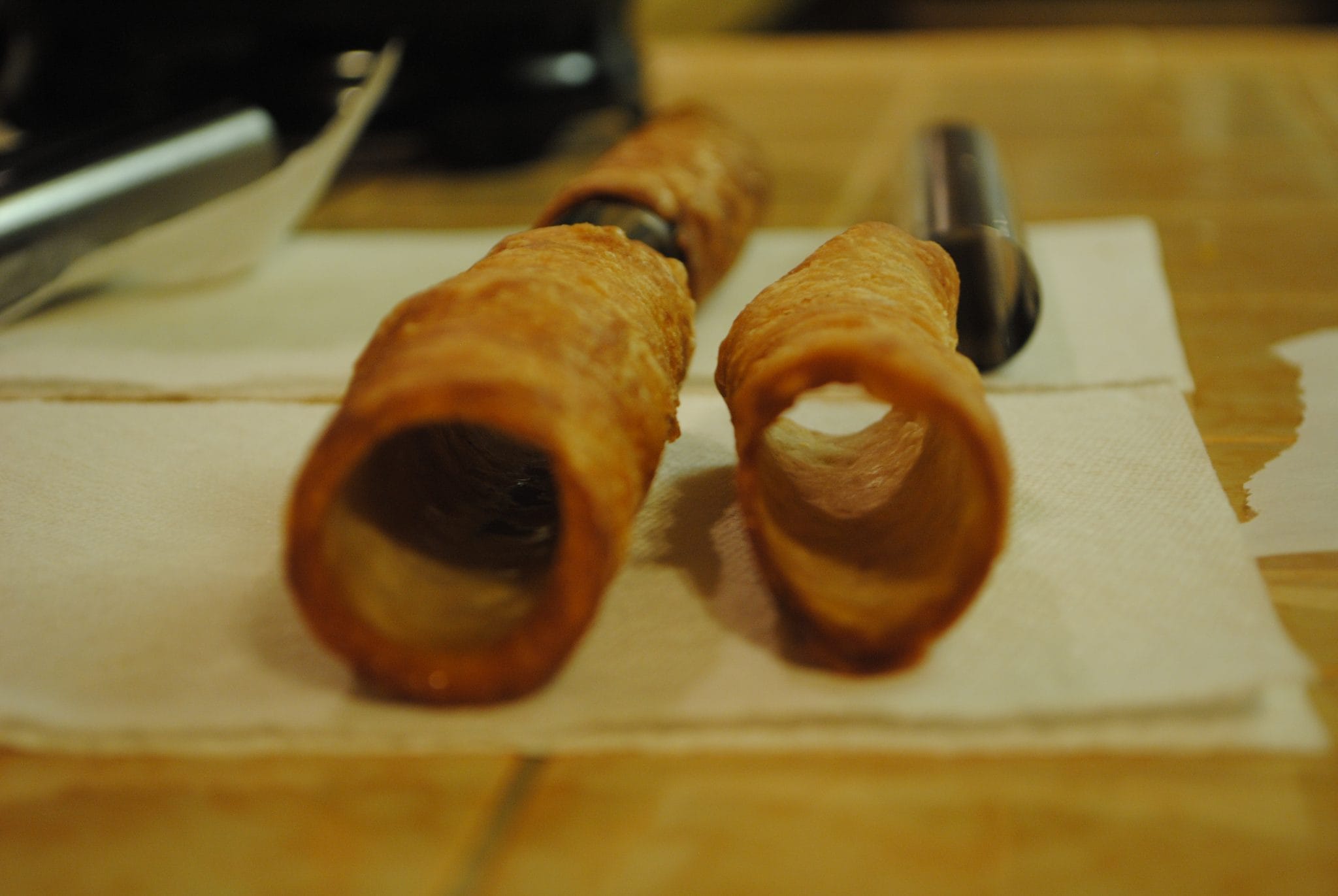 Close up view of cooked cannoli dough.