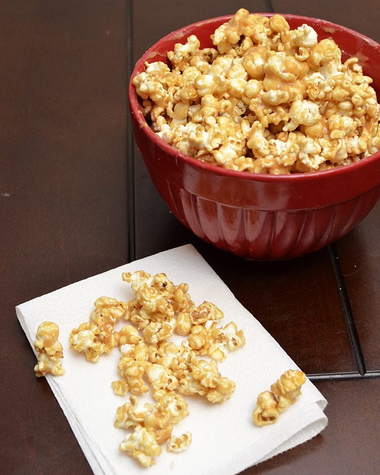 Angled view of peanut butter popcorn in a bowl.