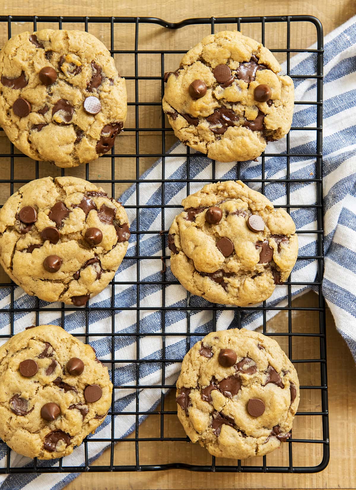 Chocolate chip cookies made with applesauce on a cooling rack.