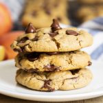 A stack of three applesauce chocolate chip cookies on a plate.