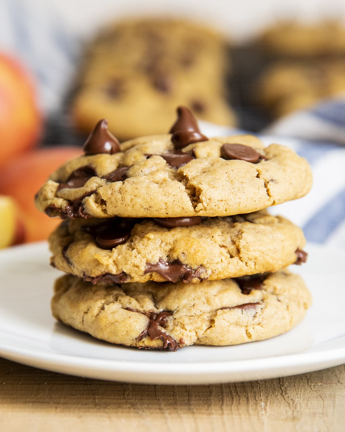 A stack of three applesauce chocolate chip cookies on a plate.