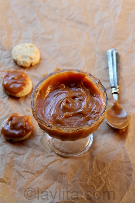 Top view of homemade dulce de leche with a spoon.