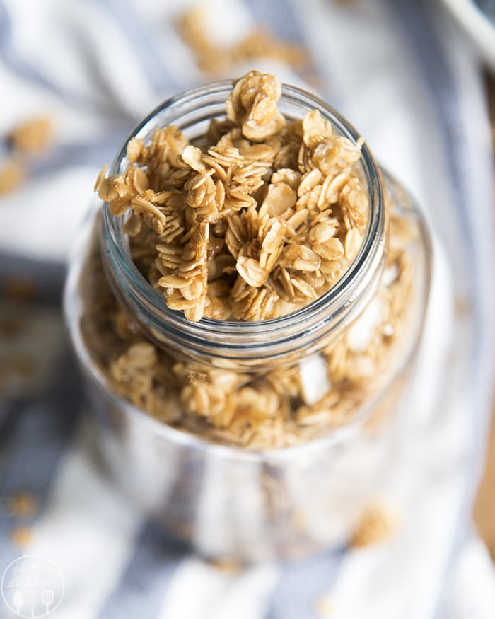 An overhead shot of homemade granola in a jar.