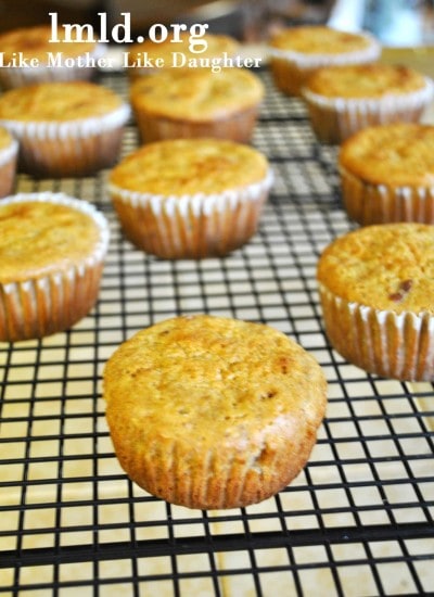 Front view of carrot cake muffins on a cooling rack.