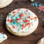 A sugar cookie topped with red and blue poprocks.