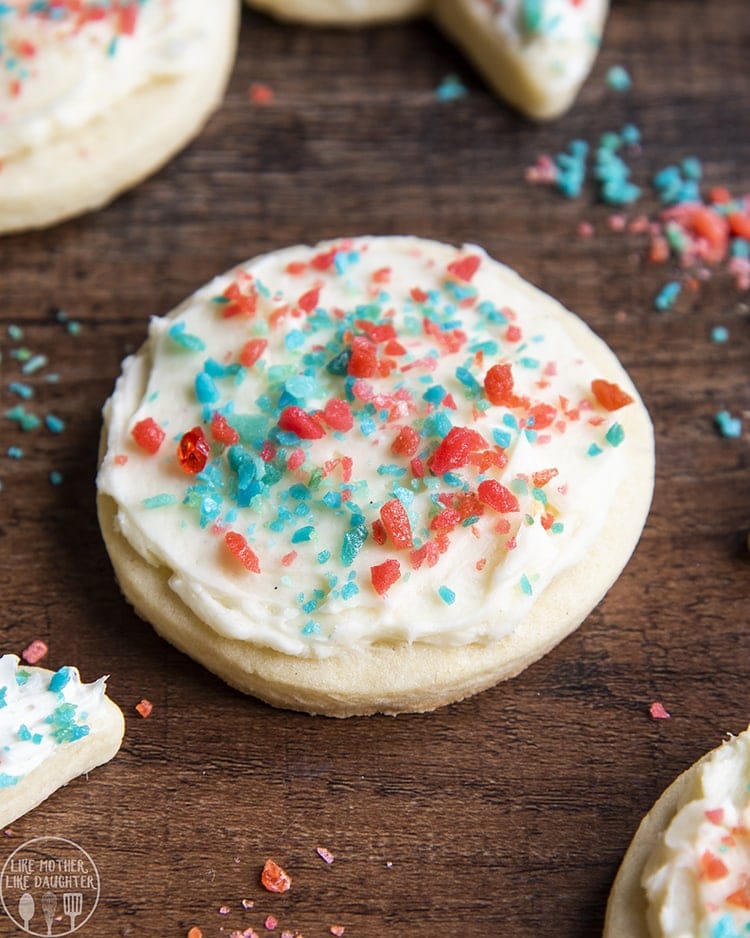 A sugar cookie topped with red and blue poprocks.