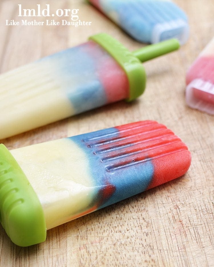 Close up view of red white and blue popsicles.