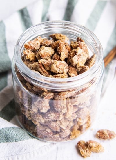 A glass jar full of candied almonds.