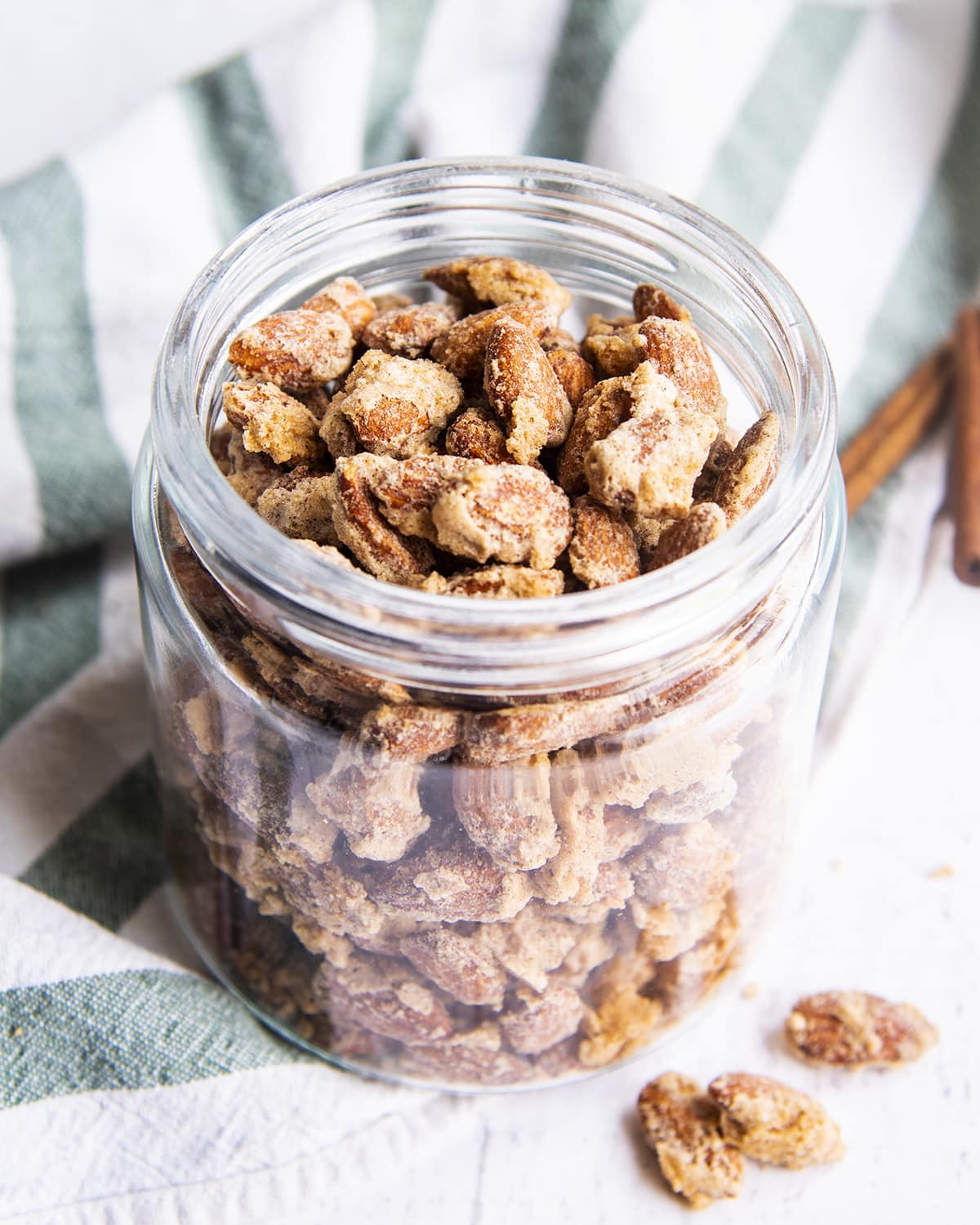 A glass jar full of candied almonds.