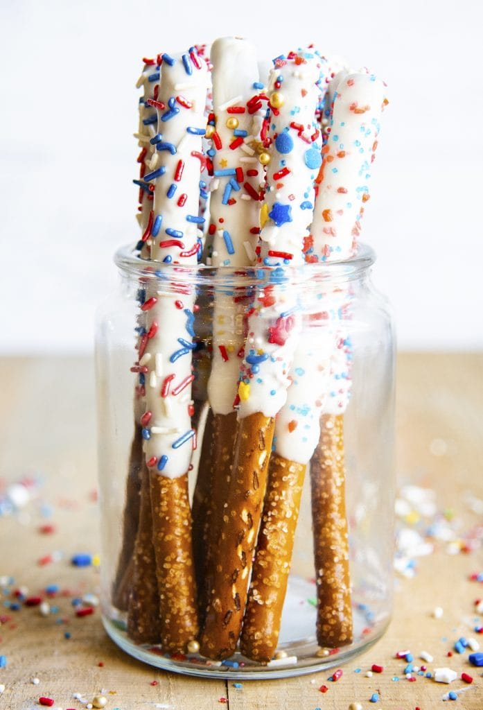 Fourth of July White Chocolate Pretzels dipped in white chocolate and topped with sprinkles.