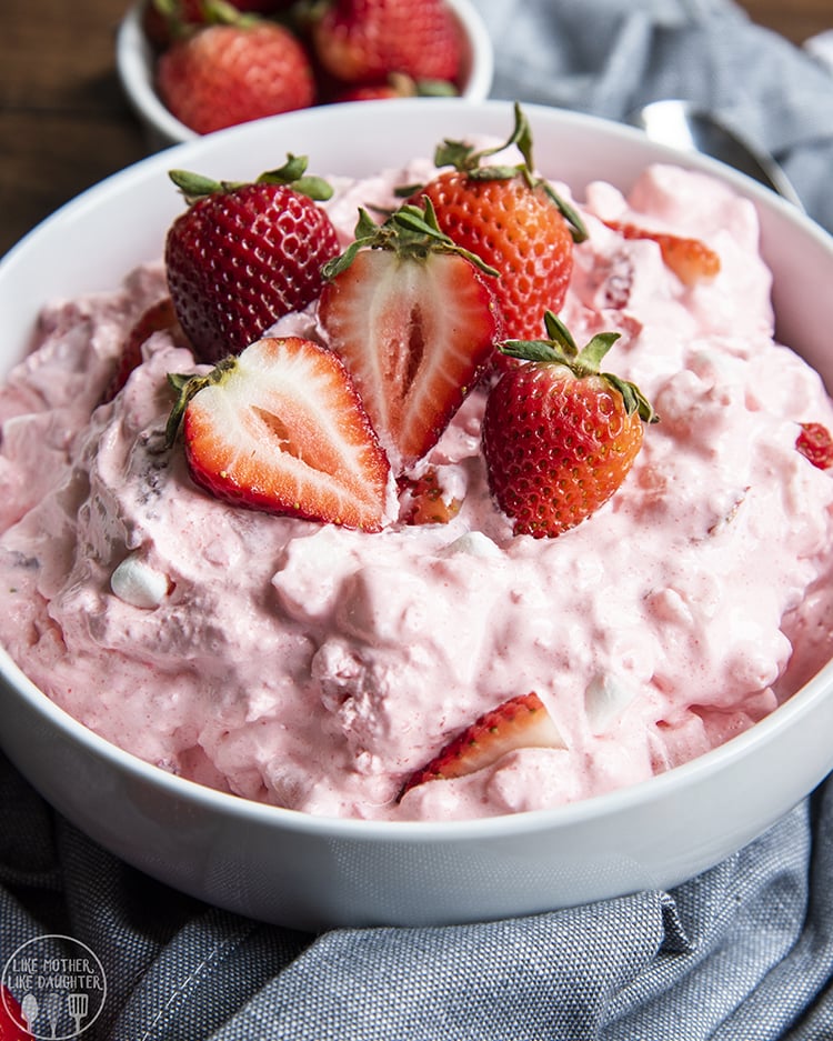 A bowl of strawberry jello and cottage cheese fluff.