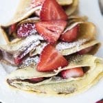 Front view of crepes with strawberries.
