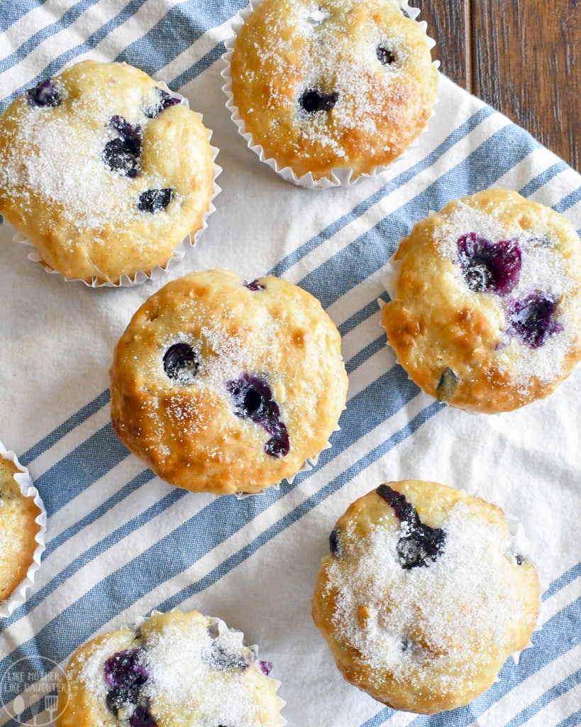 An overhead photo of blueberry and orange muffins.