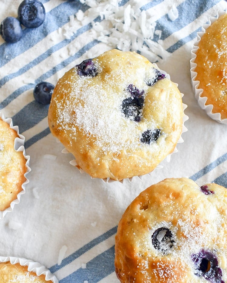 Blueberry coconut orange muffins with coarse sugar on top.