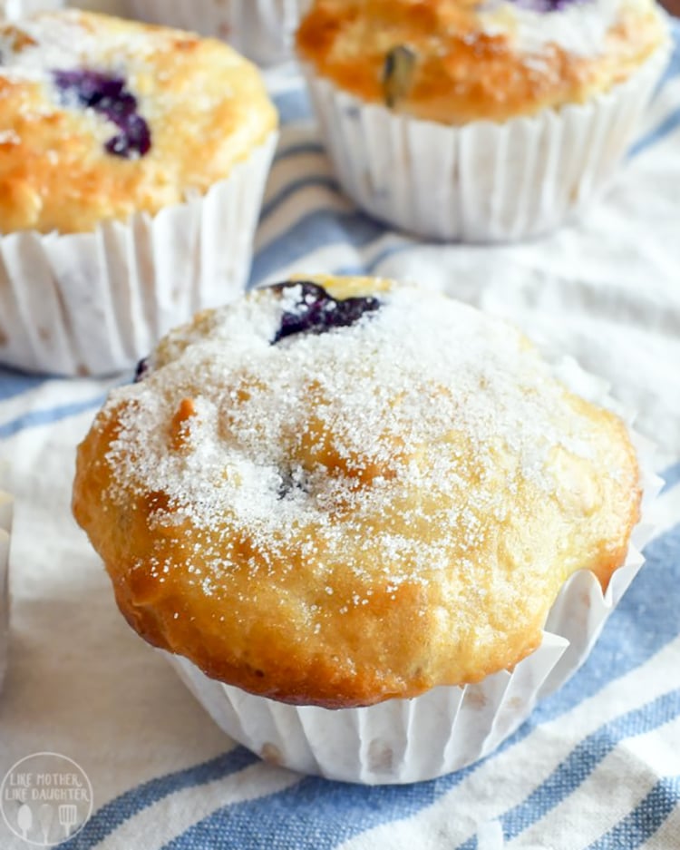 A close up of a blueberry coconut orange muffin.