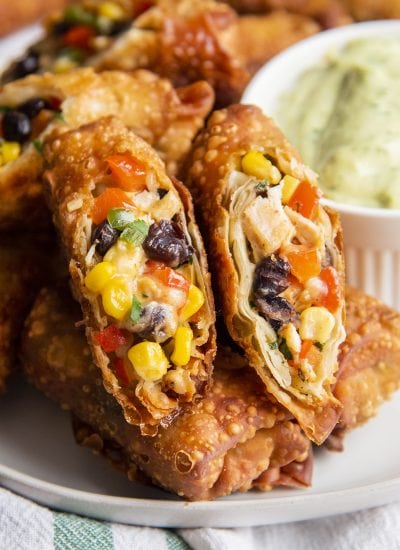 Fried southwest chicken egg rolls full of corn, black beans, chicken, and bell pepper.