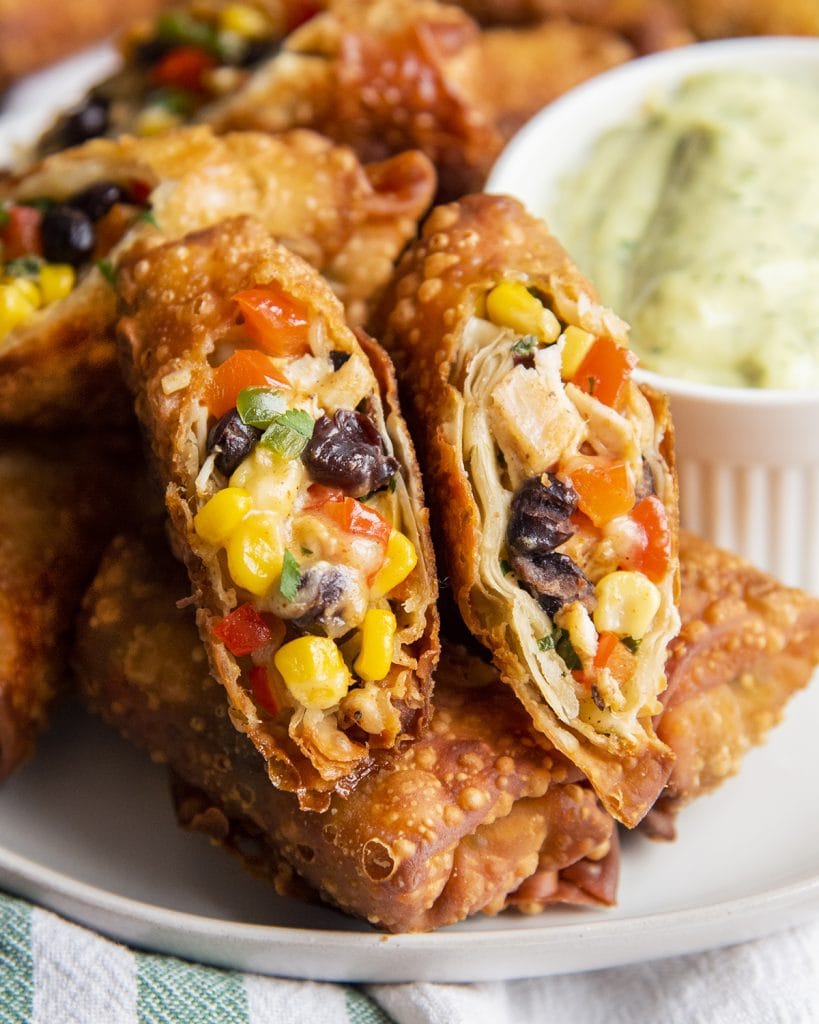 Fried southwest chicken egg rolls full of corn, black beans, chicken, and bell pepper.