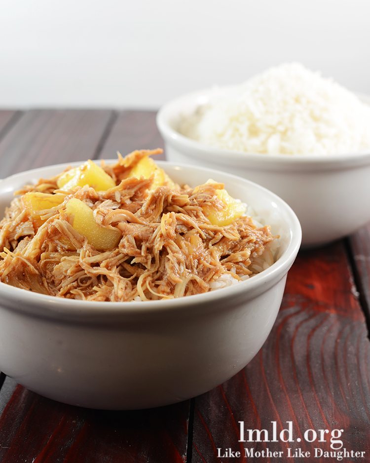 Front view of hawaiian BBQ chicken over rice in a white bowl.