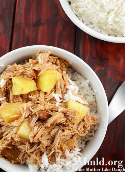 Top view of hawaiian BBQ chicken over rice in a white bowl.