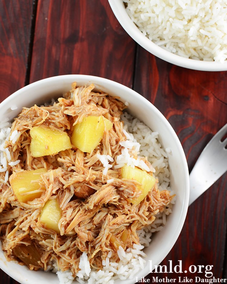 Top view of hawaiian BBQ chicken over rice in a white bowl.