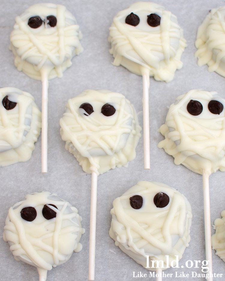 Oreos dipped in white chocolate and decorated to look like mummies. 