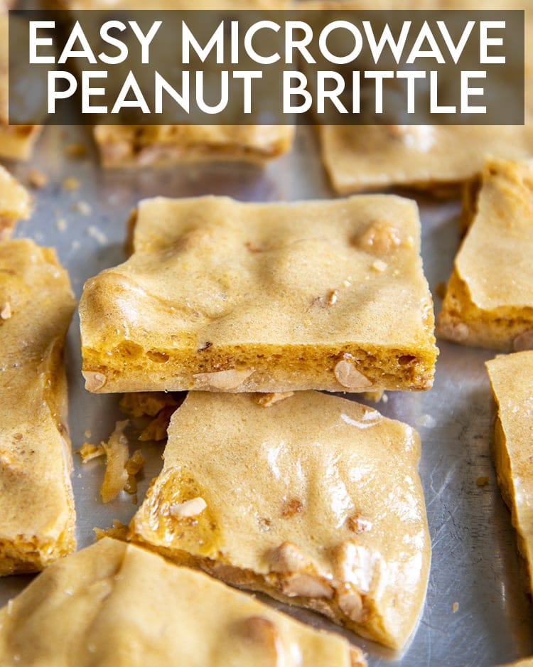 Peanut brittle pieces on a baking pan, with a text overlay over the top of the photo for pinterest. 