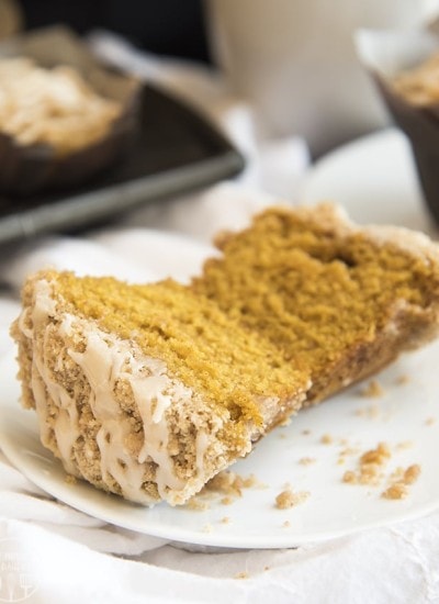 These Pumpkin Muffins are perfection. They are moist, flavorful, and topped with a cinnamon streusel crumb topping and a drizzle of vanilla icing; the perfect pumpkin treat!
