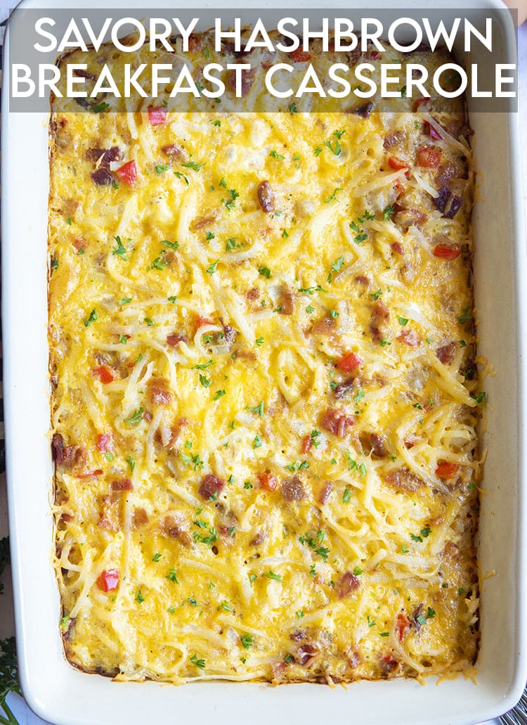 An above shot of breakfast casserole with cheese and potatoes with parsley sprinkles