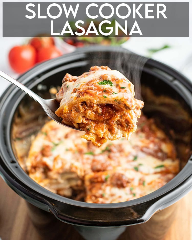 A piece of slow cooker lasagna being pulled out of a slow cooker with a spoon.