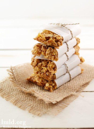 Front view of peanut butter and honey bunches of oats granola bars stacked up.