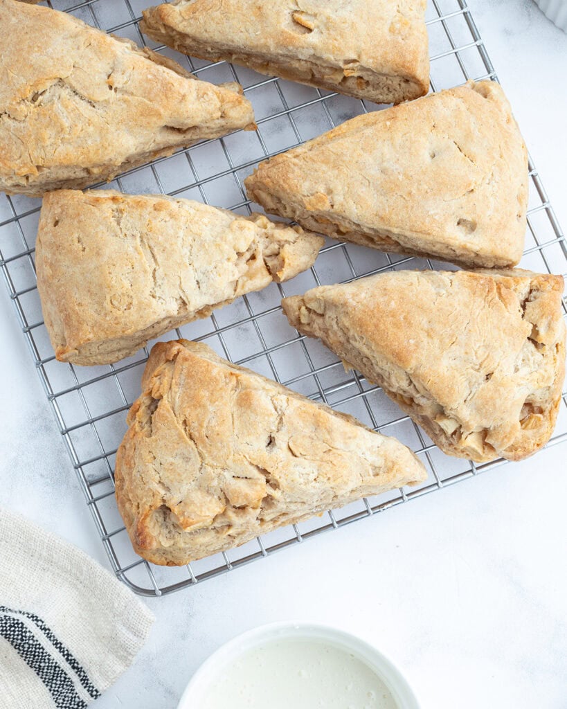 Apple scones on a wire rack.