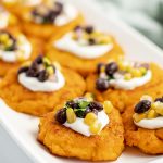 Sweet potato patties topped with sour cream and a corn and black bean salsa.
