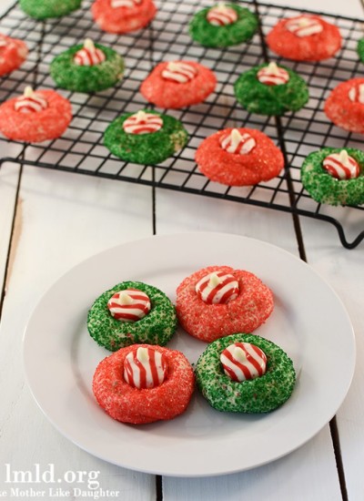 Front view of candy cane blossoms on a white plate.