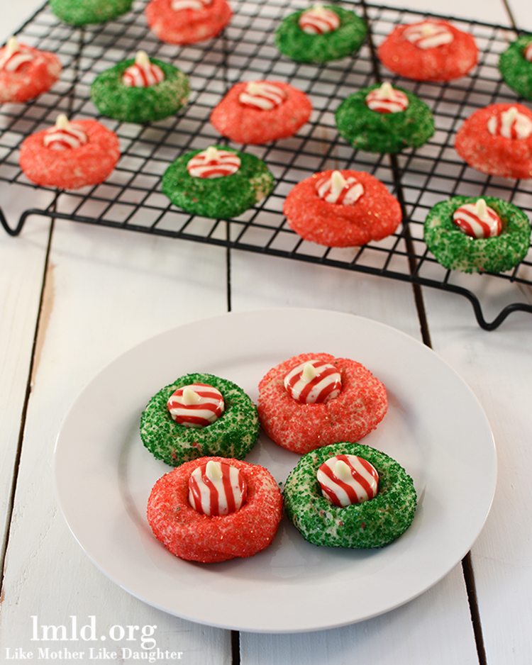 Front view of candy cane blossoms on a white plate.