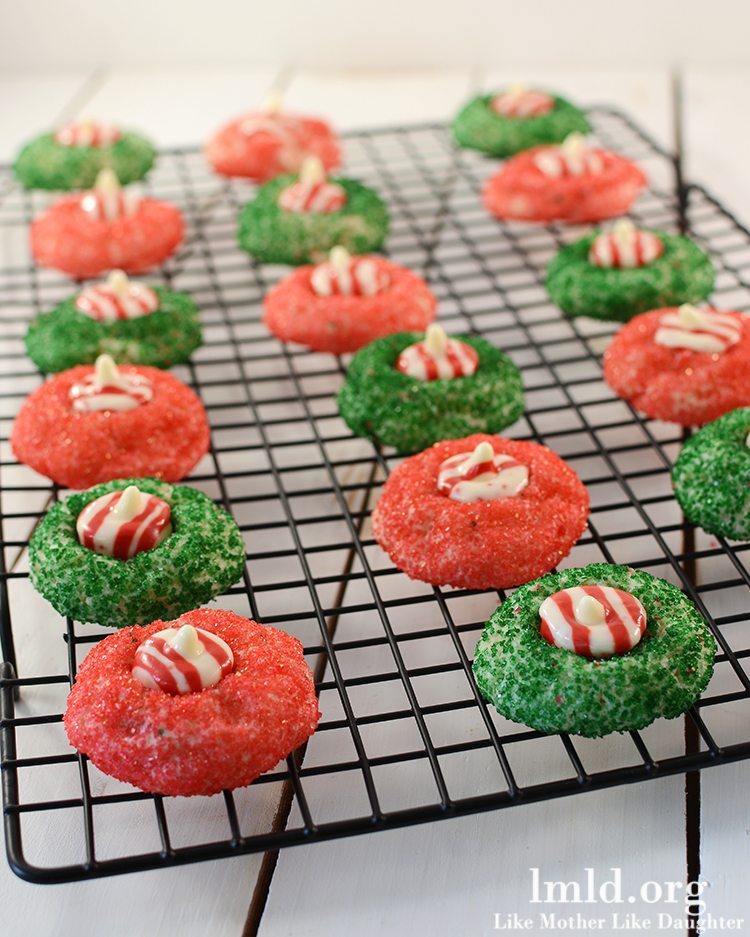 Angled view of candy cane blossoms on a cooling rack.