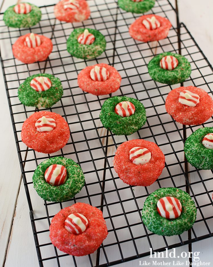 Angled view of candy cane blossoms on a cooling rack.
