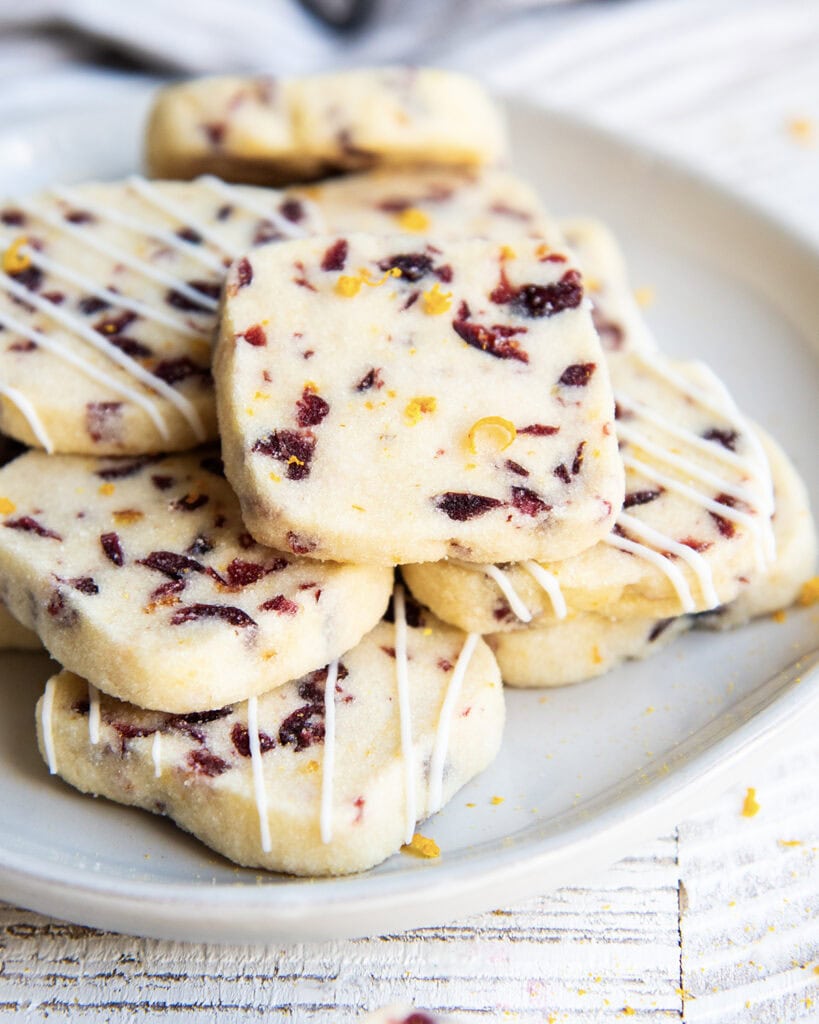 A plate of cranberry orange shortbread cookies.