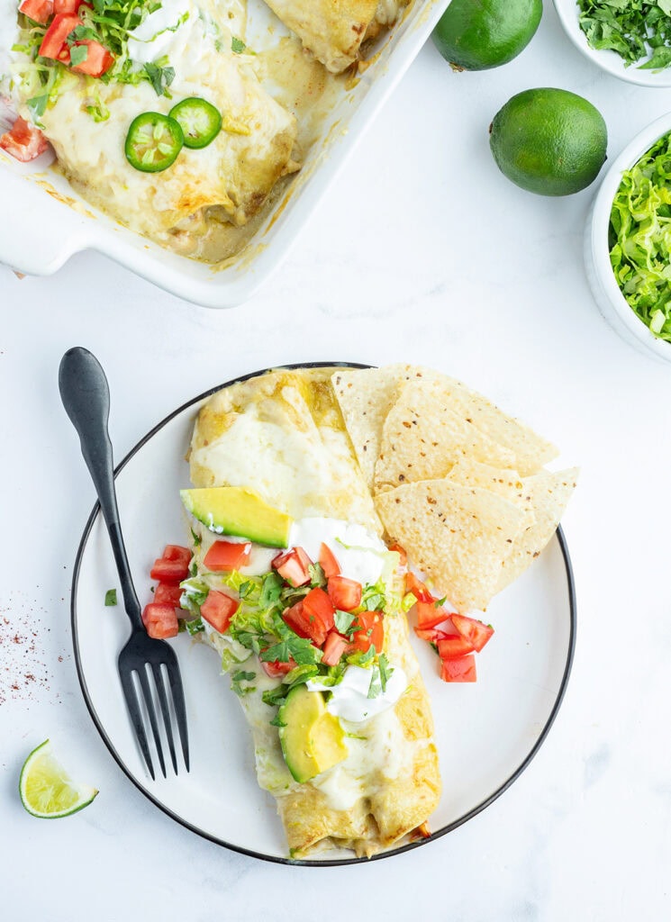 An above view of a plate of honey lime chicken enchiladas.