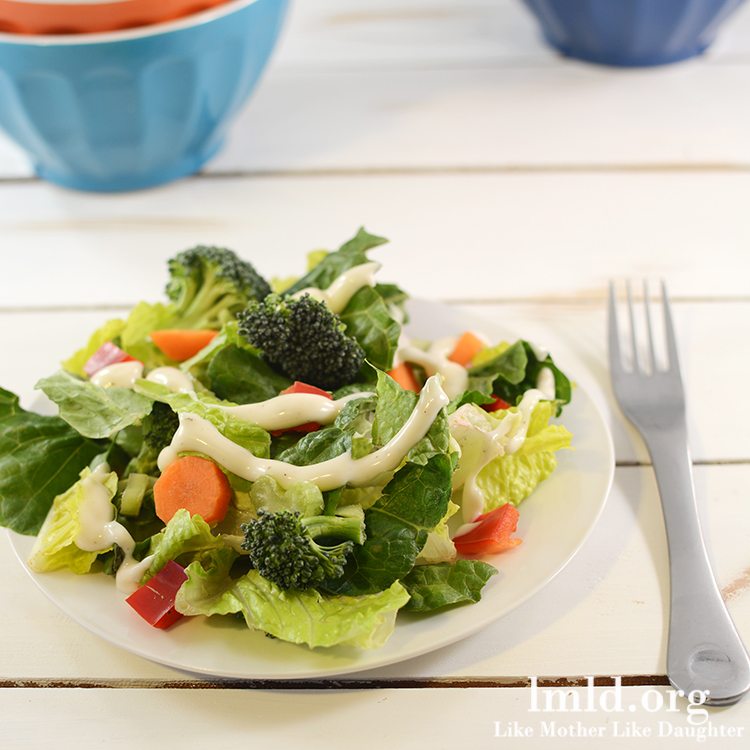 Front view of easy side salad on a white plate.