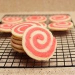 Front view of valentines pinwheel cookies on a cooling rack.