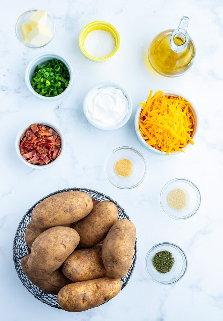 The Ingredients Needed to make baked potato skins in small bowls.