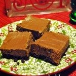Front view of mint truffle squares on a green festive plate.