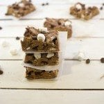 Front view of smores bars on a wooden board.