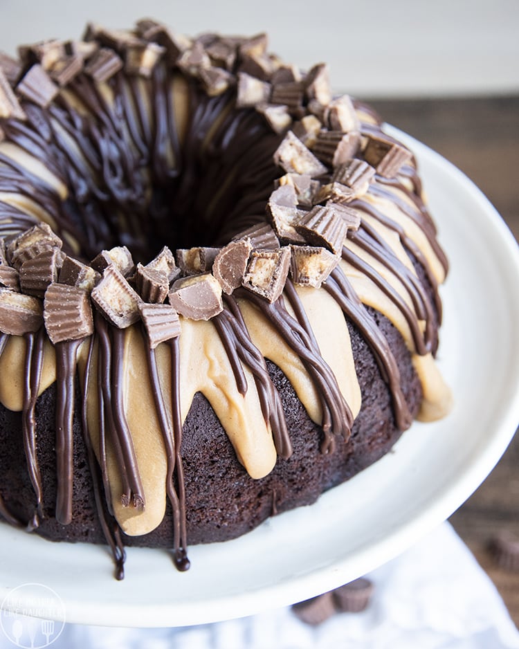 Chocolate peanut butter bundt cake topped with peanut butter and chocolate ganache and peanut butter cups